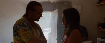Movie still from “Spring Breakers” (2012), directed by Harmony Korine – A man and a woman standing next to each other in front of a door; Close Up shot, Over the shoulder angle