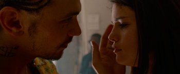 Movie still from “Spring Breakers” (2012), directed by Harmony Korine – A man and a woman looking at each other; Close Up shot, Over the shoulder angle