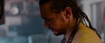 Movie still from “Spring Breakers” (2012), directed by Harmony Korine – A person wearing a necklace; Close Up shot, Over the shoulder angle
