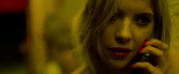 Movie still from “Spring Breakers” (2012), directed by Harmony Korine – A woman's face with long blonde hair; Extreme Close Up shot, Overhead angle