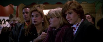 Movie still from “St. Elmo's Fire” (1985), directed by Joel Schumacher – A group of women sitting next to each other; Close Up shot, Low angle