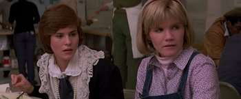 Movie still from “St. Elmo's Fire” (1985), directed by Joel Schumacher – Two women sitting next to each other in a room; Close Up shot, Over the shoulder angle