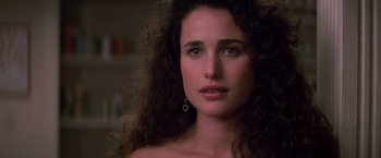 Movie still from “St. Elmo's Fire” (1985), directed by Joel Schumacher – A person with long curly hair; Close Up shot, Over the shoulder angle