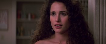 Movie still from “St. Elmo's Fire” (1985), directed by Joel Schumacher – A person with curly hair; Close Up shot, Over the shoulder angle