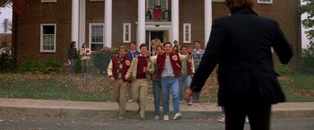 Movie still from “St. Elmo's Fire” (1985), directed by Joel Schumacher – A group of young men walking down the street; Wide shot, High angle