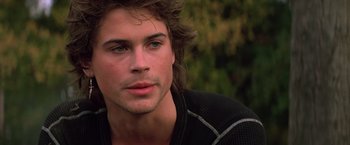 Movie still from “St. Elmo's Fire” (1985), directed by Joel Schumacher – A person with long hair; Close Up shot, Over the shoulder angle