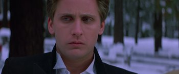 Movie still from “St. Elmo's Fire” (1985), directed by Joel Schumacher – A person wearing a suit and tie; Close Up shot, Low angle