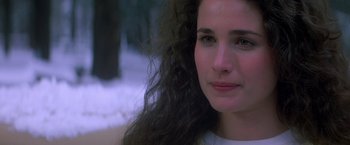 Movie still from “St. Elmo's Fire” (1985), directed by Joel Schumacher – A person with long curly hair; Close Up shot, Over the shoulder angle