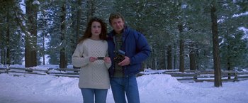 Movie still from “St. Elmo's Fire” (1985), directed by Joel Schumacher – A man and a woman standing next to each other in the snow; Medium shot, High angle