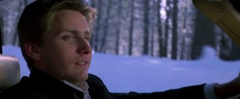 Movie still from “St. Elmo's Fire” (1985), directed by Joel Schumacher – A person sitting on a couch in a room; Close Up shot, Low angle