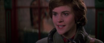 Movie still from “St. Elmo's Fire” (1985), directed by Joel Schumacher – A person wearing a jacket; Close Up shot, Over the shoulder angle