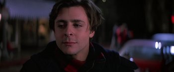 Movie still from “St. Elmo's Fire” (1985), directed by Joel Schumacher – A person wearing a jacket; Close Up shot, Low angle