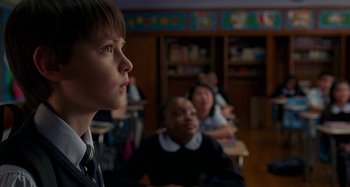Movie still from “St. Vincent” (2014), directed by Theodore Melfi – A group of people sitting in a room; Close Up shot, Low angle
