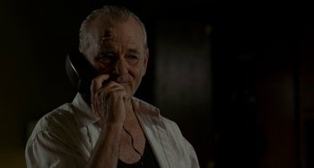 Movie still from “St. Vincent” (2014), directed by Theodore Melfi – An older man is talking on the phone; Close Up shot, Low angle