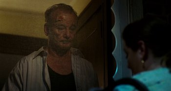 Movie still from “St. Vincent” (2014), directed by Theodore Melfi – A man is looking at himself in the mirror; Close Up shot, Over the shoulder angle