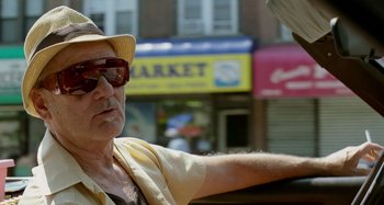 Movie still from “St. Vincent” (2014), directed by Theodore Melfi – An older man wearing a hat and sunglasses; Close Up shot, Low angle