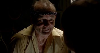 Movie still from “St. Vincent” (2014), directed by Theodore Melfi – An older man wearing a yellow shirt and a headband; Close Up shot, Over the shoulder angle