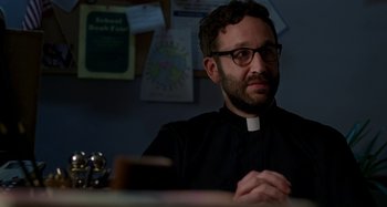 Movie still from “St. Vincent” (2014), directed by Theodore Melfi – A man sitting at a table in front of books; Close Up shot, Low angle