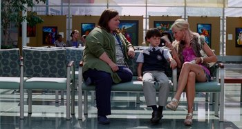 Movie still from “St. Vincent” (2014), directed by Theodore Melfi – A group of people sitting on a bench; Wide shot, Over the shoulder angle