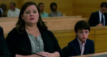 Movie still from “St. Vincent” (2014), directed by Theodore Melfi – A woman and a boy sitting in a court room; Close Up shot, Low angle