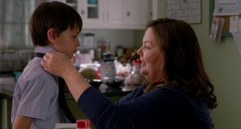 Movie still from “St. Vincent” (2014), directed by Theodore Melfi – A woman and a boy in a kitchen; Close Up shot, Over the shoulder angle