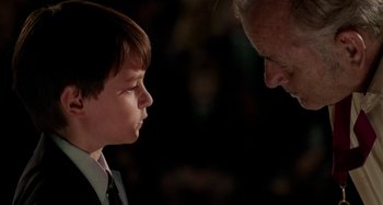 Movie still from “St. Vincent” (2014), directed by Theodore Melfi – A boy and an older man looking at each other; Close Up shot, Over the shoulder angle