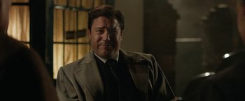 Movie still from “Stan & Ollie” (2018), directed by Jon S. Baird – A person wearing a suit and tie; Close Up shot, Low angle