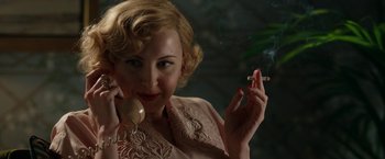 Movie still from “Stan & Ollie” (2018), directed by Jon S. Baird – A woman holding a cigarette and talking on a phone; Close Up shot, Over the shoulder angle