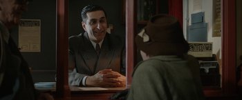 Movie still from “Stan & Ollie” (2018), directed by Jon S. Baird – A man sitting at a table in front of a mirror; Medium shot, Over the shoulder angle