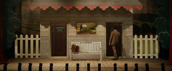 Movie still from “Stan & Ollie” (2018), directed by Jon S. Baird – A man standing in front of a bench; Extreme Wide shot, High angle