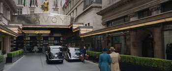 Movie still from “Stan & Ollie” (2018), directed by Jon S. Baird – A group of people standing on the side of a road; Extreme Wide shot, Low angle