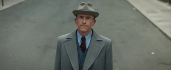 Movie still from “Stan & Ollie” (2018), directed by Jon S. Baird – A man wearing a suit and a hat; Close Up shot, Low angle