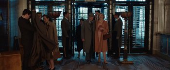 Movie still from “Stan & Ollie” (2018), directed by Jon S. Baird – A man and a woman are standing in front of a door way; Wide shot, Low angle