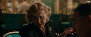 Movie still from “Stan & Ollie” (2018), directed by Jon S. Baird – An older woman looking down at her phone; Close Up shot, Over the shoulder angle