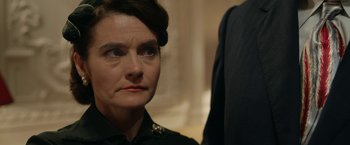 Movie still from “Stan & Ollie” (2018), directed by Jon S. Baird – A person wearing a uniform; Close Up shot, Over the shoulder angle