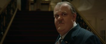 Movie still from “Stan & Ollie” (2018), directed by Jon S. Baird – An older man with a mustache and a suit and tie; Close Up shot, Low angle