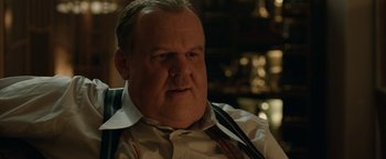Movie still from “Stan & Ollie” (2018), directed by Jon S. Baird – A man with a beard and a mustache wearing suspenders; Close Up shot, Over the shoulder angle