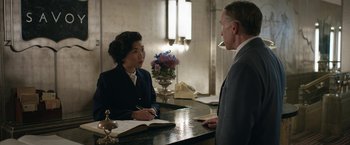 Movie still from “Stan & Ollie” (2018), directed by Jon S. Baird – A man and a woman sitting at a counter; Medium shot, Over the shoulder angle