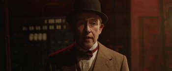 Movie still from “Stan & Ollie” (2018), directed by Jon S. Baird – An older man wearing a suit and a hat; Close Up shot, Low angle