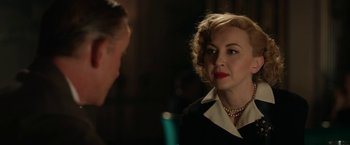 Movie still from “Stan & Ollie” (2018), directed by Jon S. Baird – A man and a woman are talking to each other in a dark room; Close Up shot, Over the shoulder angle
