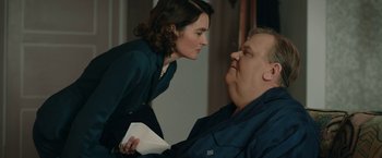 Movie still from “Stan & Ollie” (2018), directed by Jon S. Baird – A man and a woman face to face in front of a window; Medium shot, Over the shoulder angle