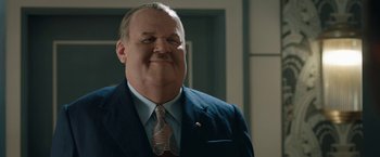 Movie still from “Stan & Ollie” (2018), directed by Jon S. Baird – A person wearing a suit and tie; Close Up shot, Low angle