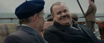 Movie still from “Stan & Ollie” (2018), directed by Jon S. Baird – Two men sitting next to each other on a bench; Close Up shot, Over the shoulder angle