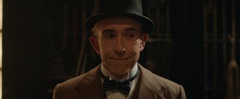 Movie still from “Stan & Ollie” (2018), directed by Jon S. Baird – An older man wearing a hat and a bow tie; Close Up shot, Low angle