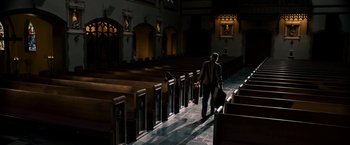 Movie still from “Stand Up Guys” (2012), directed by Fisher Stevens – A man walking down the aisle of a church; Extreme Wide shot, High angle