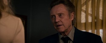 Movie still from “Stand Up Guys” (2012), directed by Fisher Stevens – A person wearing a suit and tie; Close Up shot, Low angle