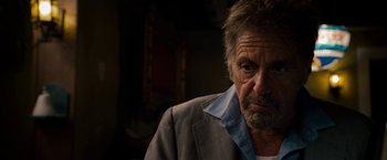 Movie still from “Stand Up Guys” (2012), directed by Fisher Stevens – An older man wearing a jacket and a shirt; Close Up shot, Over the shoulder angle