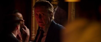 Movie still from “Stand Up Guys” (2012), directed by Fisher Stevens – An older man wearing a suit and tie looking at the camera; Close Up shot, Over the shoulder angle