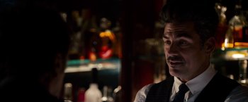 Movie still from “Stand Up Guys” (2012), directed by Fisher Stevens – A man in a suit and tie in front of a pool table; Close Up shot, Over the shoulder angle