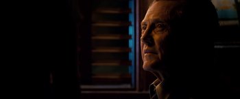 Movie still from “Stand Up Guys” (2012), directed by Fisher Stevens – An older man looking out of a window at night; Close Up shot, Over the shoulder angle